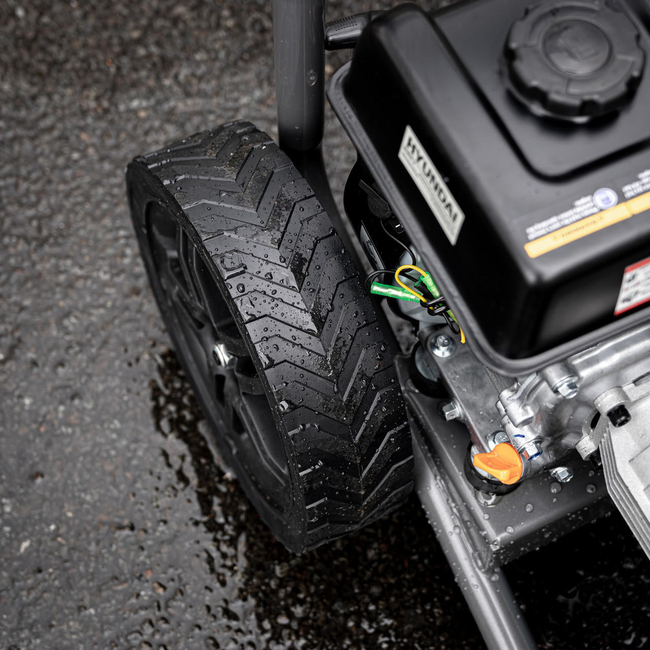 Close up view if the Hyundai Petrol High-Pressure Washer in use.