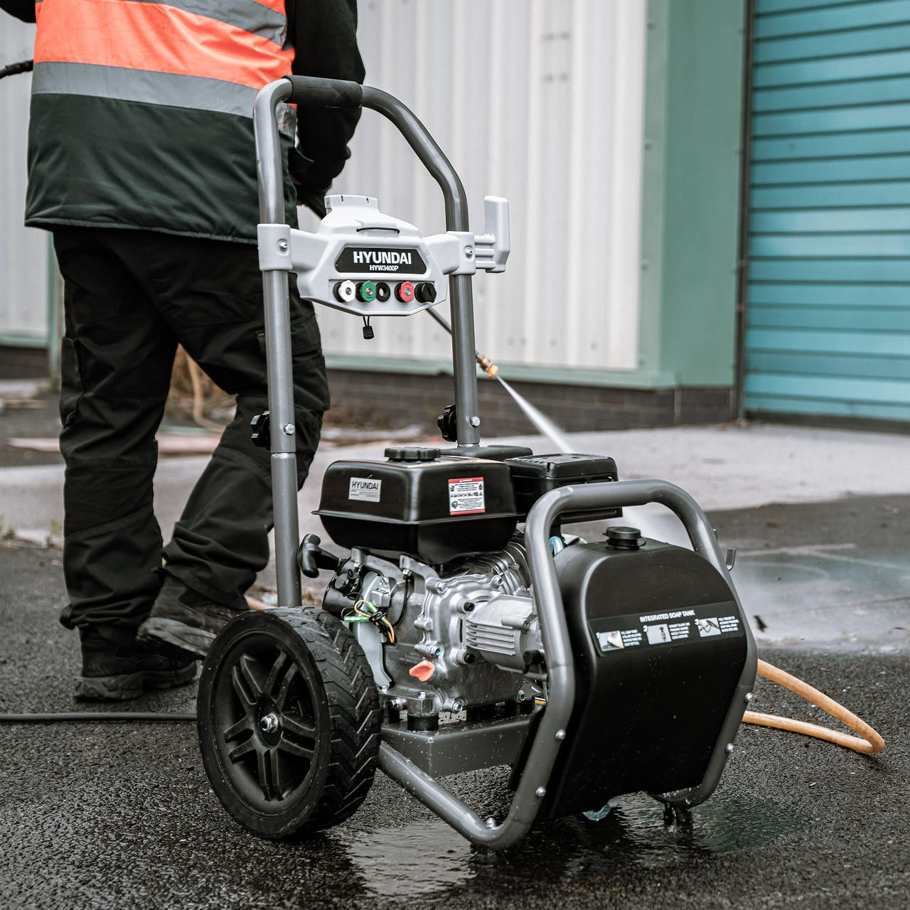 In use: Hyundai 209cc 3400psi Petrol High-Pressure Washer, 5 Nozzle Attachments, Axial Pump, 10m Hose & 5L Detergent Tank | HYW3400P